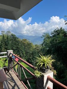 a balcony with a view of the mountains at Marmen Homestay in Kalimpong