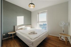 Postel nebo postele na pokoji v ubytování Apartamenty Dominikańska