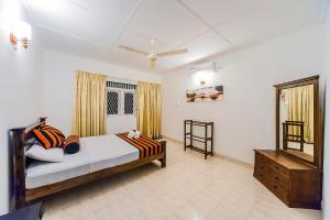 Postel nebo postele na pokoji v ubytování Cloud Inn Kandy Homestay