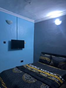 Ένα ή περισσότερα κρεβάτια σε δωμάτιο στο Okiroro Green Field Hotel +3 φωτογραφίες