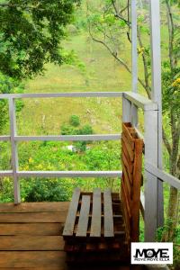 a wooden bench sitting on top of a porch at moye moye Ella in Ella