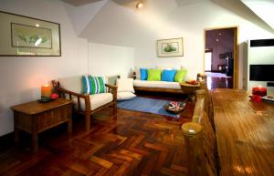 a living room with a couch and a table at 357 Boracay Resort in Boracay