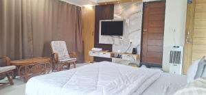 Μια τηλεόραση ή/και κέντρο ψυχαγωγίας στο Aavasan home stay