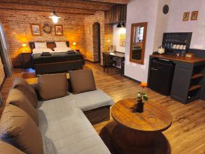 a living room with a couch and a bed and a table at Domus Nö58 in Litomyšl