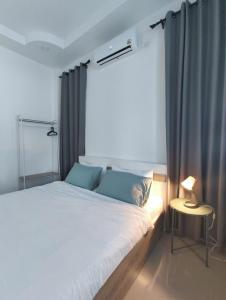 Ένα ή περισσότερα κρεβάτια σε δωμάτιο στο Botanic Wind