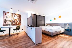 Ένα ή περισσότερα κρεβάτια σε δωμάτιο στο Stay by Triller - Aparthotel