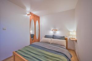 Ένα ή περισσότερα κρεβάτια σε δωμάτιο στο Apartment Aš centrum