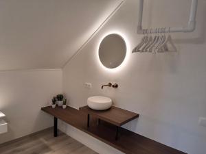 a bathroom with a sink and a mirror at De Horizon in de Westhoek in Poperinge +48 photos
