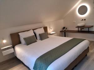 Postel nebo postele na pokoji v ubytování De Horizon in de Westhoek