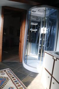 an open door to a room with a glass wall at Hotel Damian Park Hotel Delle Magnolie in Trofarello +59 photos