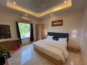 Ένα ή περισσότερα κρεβάτια σε δωμάτιο στο Kamal tourist guide and travel