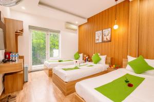 Ένα ή περισσότερα κρεβάτια σε δωμάτιο στο Hanoi Grand Sun Hotel