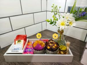 a tray with easter eggs and a vase with flowers at The Hive in Newcastle upon Tyne