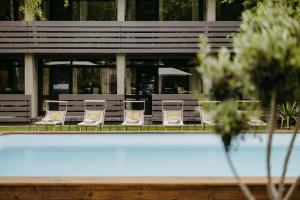 a row of chairs and tables in front of a building at Das Esel - Kleinod in Rust in Rust