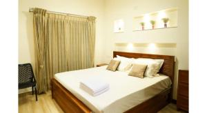 Ένα ή περισσότερα κρεβάτια σε δωμάτιο στο The Moon Graceful Villa