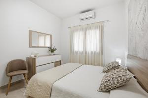 Ένα ή περισσότερα κρεβάτια σε δωμάτιο στο Figarolo apartment by Residence Moresca