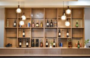 a bar with bottles of wine on shelves at Hotel GaiaYuel in Thimphu