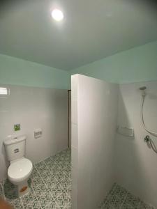 a bathroom with a toilet and a shower at Hassana Garden Home in Ko Lanta +82 photos