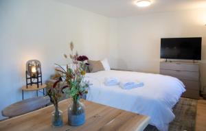 Ένα ή περισσότερα κρεβάτια σε δωμάτιο στο Studio Aurora for 2 people Lenzerheide