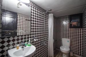 a bathroom with a sink and a toilet at ROOM iN FES MEDINA in Fès