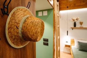 a wicker basket hanging on a wall in a room at Brvnara Vila Promaja in Kladovo