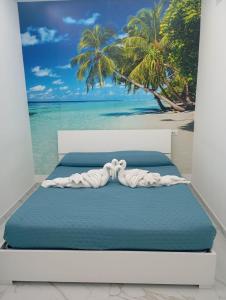 a bedroom with a bed with a view of the beach at Appartamento Smart in Frattamaggiore