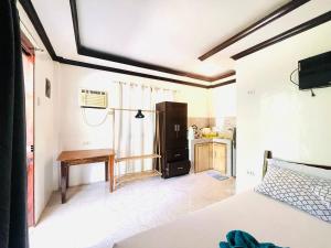 En eller flere senge i et værelse på Kiera Homestay