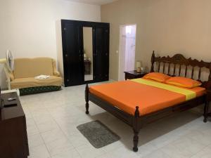 a bedroom with a bed and a chair in it at CA FILO in Espargos +9 photos
