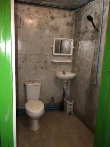 a bathroom with a toilet and a sink at Baan Suan Coconut Ko Yao Noi in Ko Yao Noi