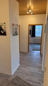 a room with a hallway with a door to a bedroom at Fewo Monteurwohnung SAW II in Salzwedel