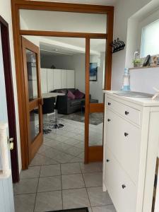 a room with a kitchen and a living room at Appartement Linda in Rheinfelden +6 photos