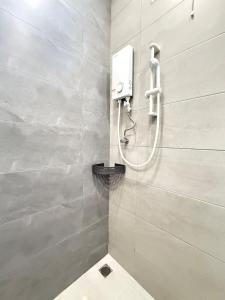 a bathroom with a shower with a toilet in it at relaxing home in Bukit Mertajam in Bukit Mertajam +21 photos