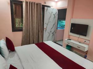 Ένα ή περισσότερα κρεβάτια σε δωμάτιο στο Hotel O 7 Seas