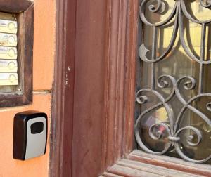 a door with a mailbox next to a window at Útulný apartmán v srdci Jihlavy in Jihlava