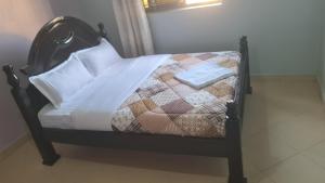 Postel nebo postele na pokoji v ubytování De Goldnest Inn