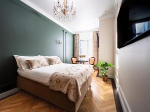 Ένα ή περισσότερα κρεβάτια σε δωμάτιο στο Strands Of Time Hotel Bruges