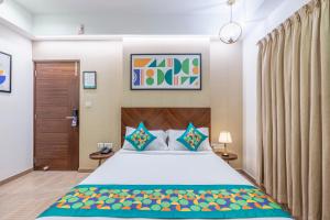 a bedroom with a bed in a room at Treebo Flora Embassy in Chennai