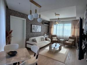 a living room with a couch and a table at 91 sqm luxury apartment with double view in Istanbul