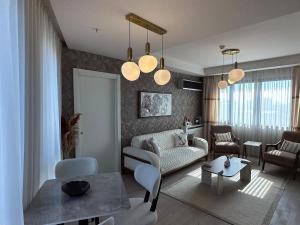 a living room with a couch and a table at 91 sqm luxury apartment with double view in Istanbul +64 photos