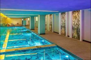 a large swimming pool in a hotel room at 91 sqm luxury apartment with double view in Istanbul