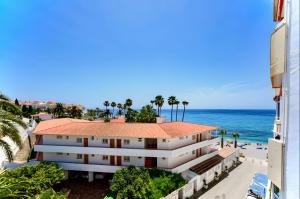 a view of the ocean from a building at Apartment 511 Torresol, Sea Views in Nerja