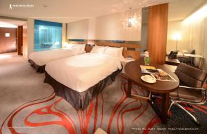 Ένα ή περισσότερα κρεβάτια σε δωμάτιο στο FleurLis Hotel +31 φωτογραφίες