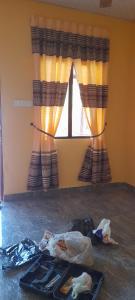 a room with a window and a tray on the floor at Batti Relax Point Villa & Rooms in Batticaloa