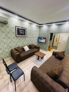 a living room with two couches and a table at Taksim Historic House hotel in Istanbul