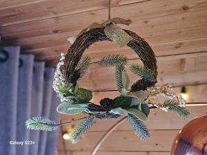 a wreath is hanging on a ceiling at LOGIS LAS CROZAS Le Mousseron orientable in Vernines