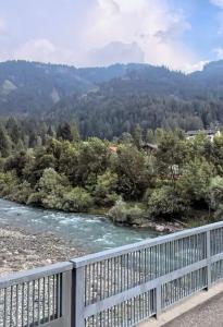 a view of a river from a bridge at Casa Checolongo in Ziano di Fiemme