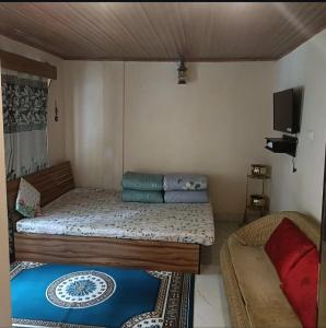 Ένα ή περισσότερα κρεβάτια σε δωμάτιο στο Mount Siniolchu