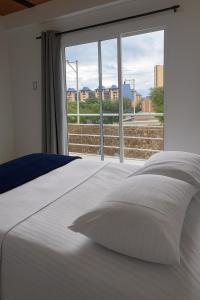 Ένα ή περισσότερα κρεβάτια σε δωμάτιο στο Casa Mariana Hostel Boutique