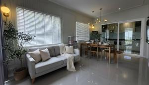a living room with a couch and a dining room at 18TU Thammasat in Pathum Thani