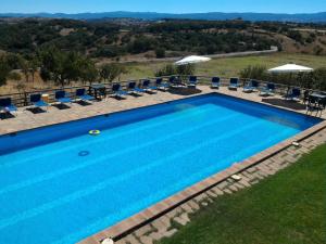 Bazén v ubytování Agriturismo Sa Pigalva nebo v jeho okolí